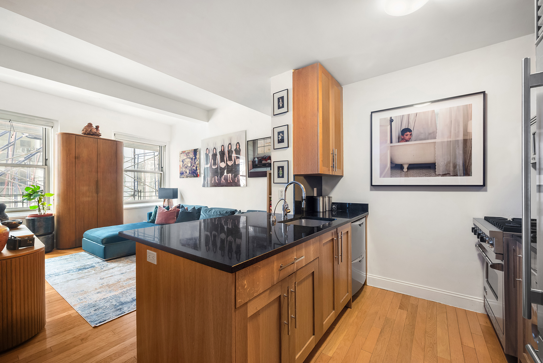 88 Greenwich Street, Unit 1605 Manhattan, NY 10006 - Photo 2 of 32 a kitchen with stainless steel appliances granite countertop a sink stove and refrigerator