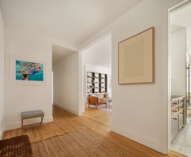 a room with wooden floor and furniture