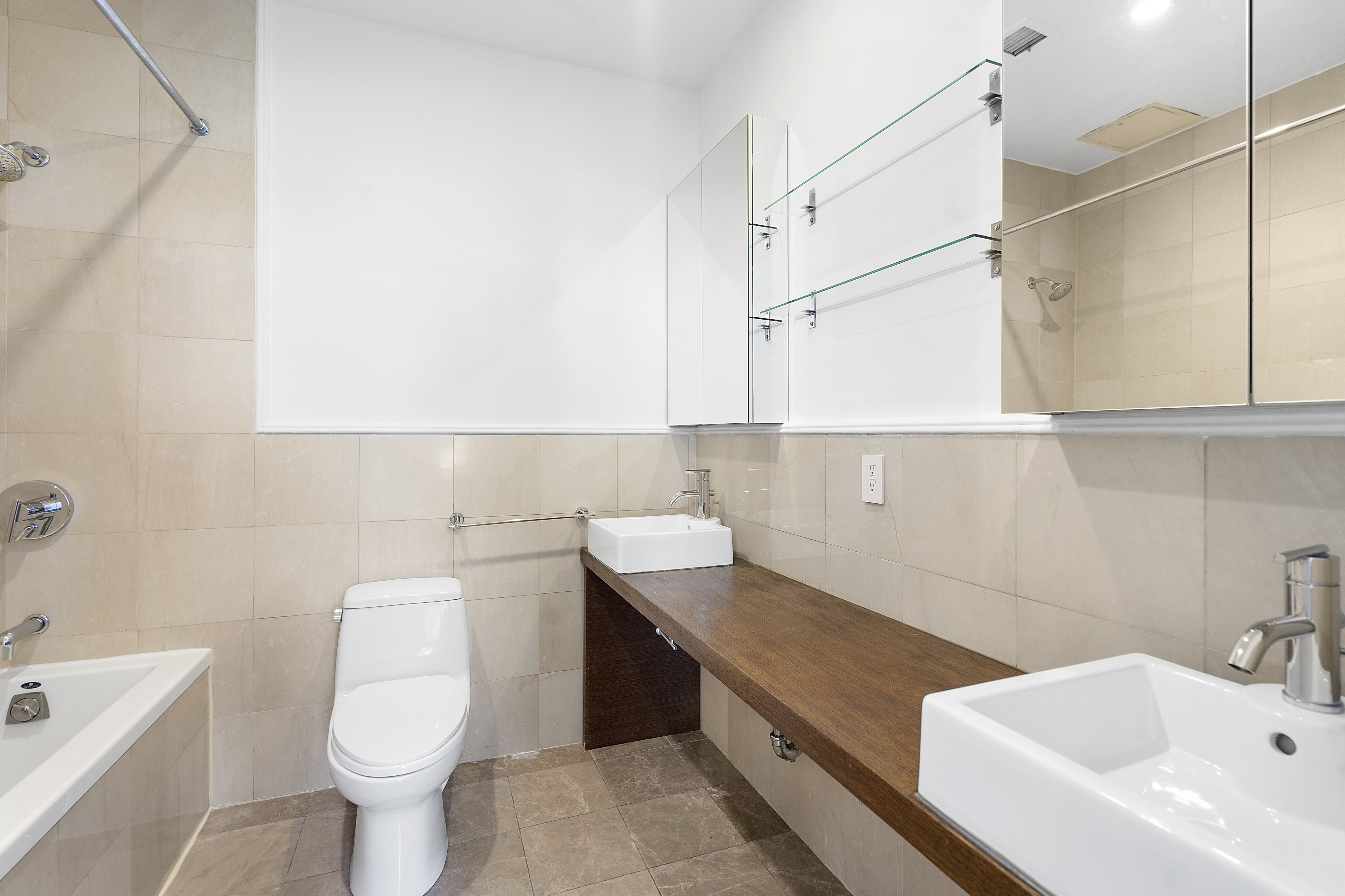 91 Grand Avenue, Unit 2D Brooklyn, NY 11205 - Photo 9 of 16 a bathroom with a sink a toilet and bathtub