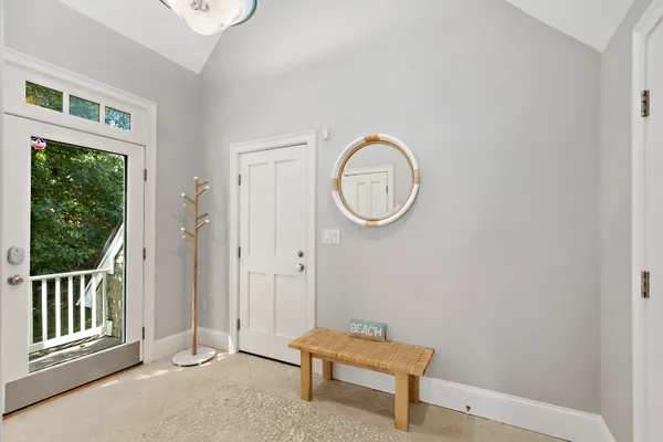 a view of a room with wooden floor and windows