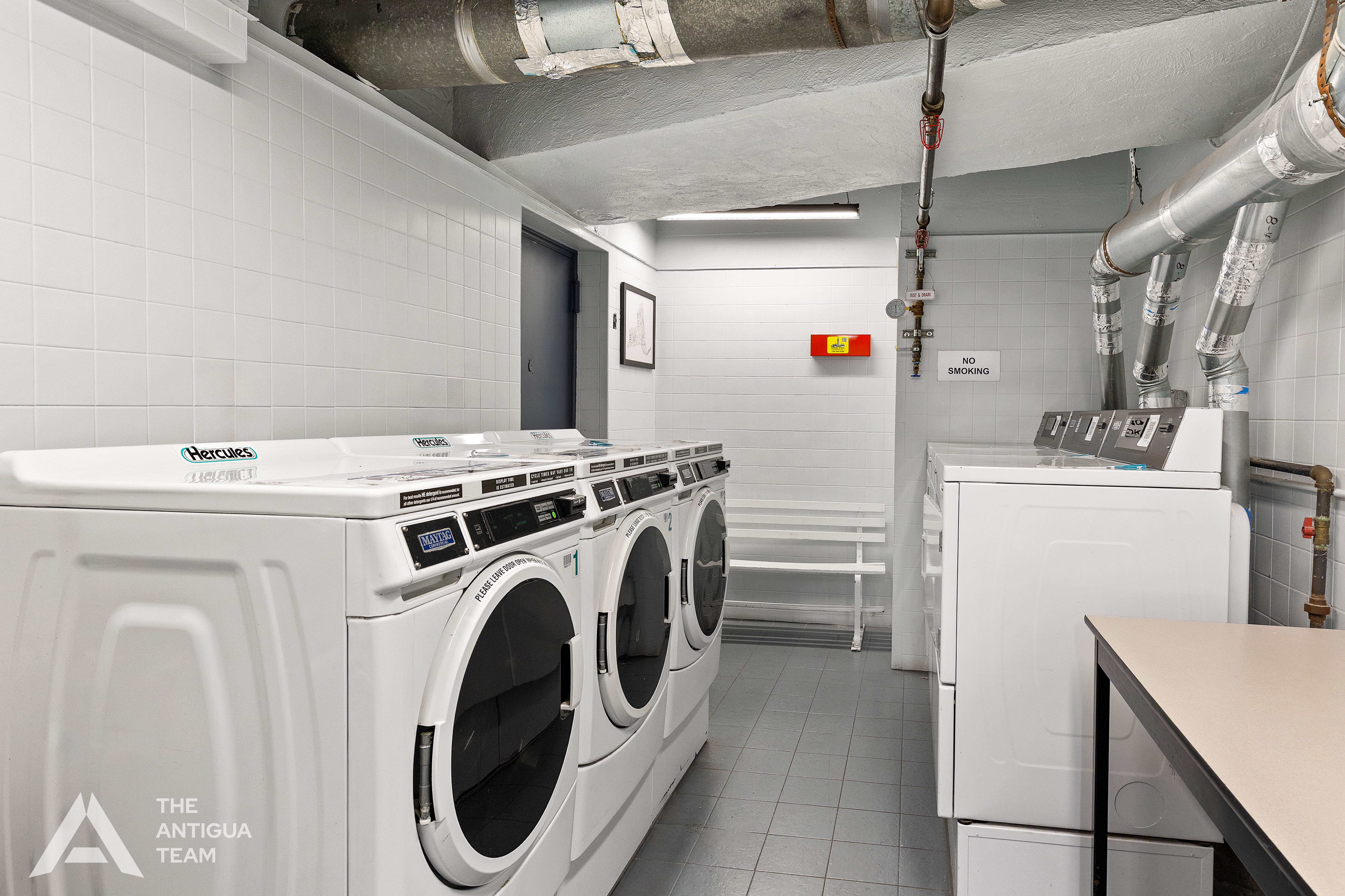 152 East 35th Street, Unit 3A Manhattan, NY 10016 - Photo 10 of 13 a utility room with dryer and washer