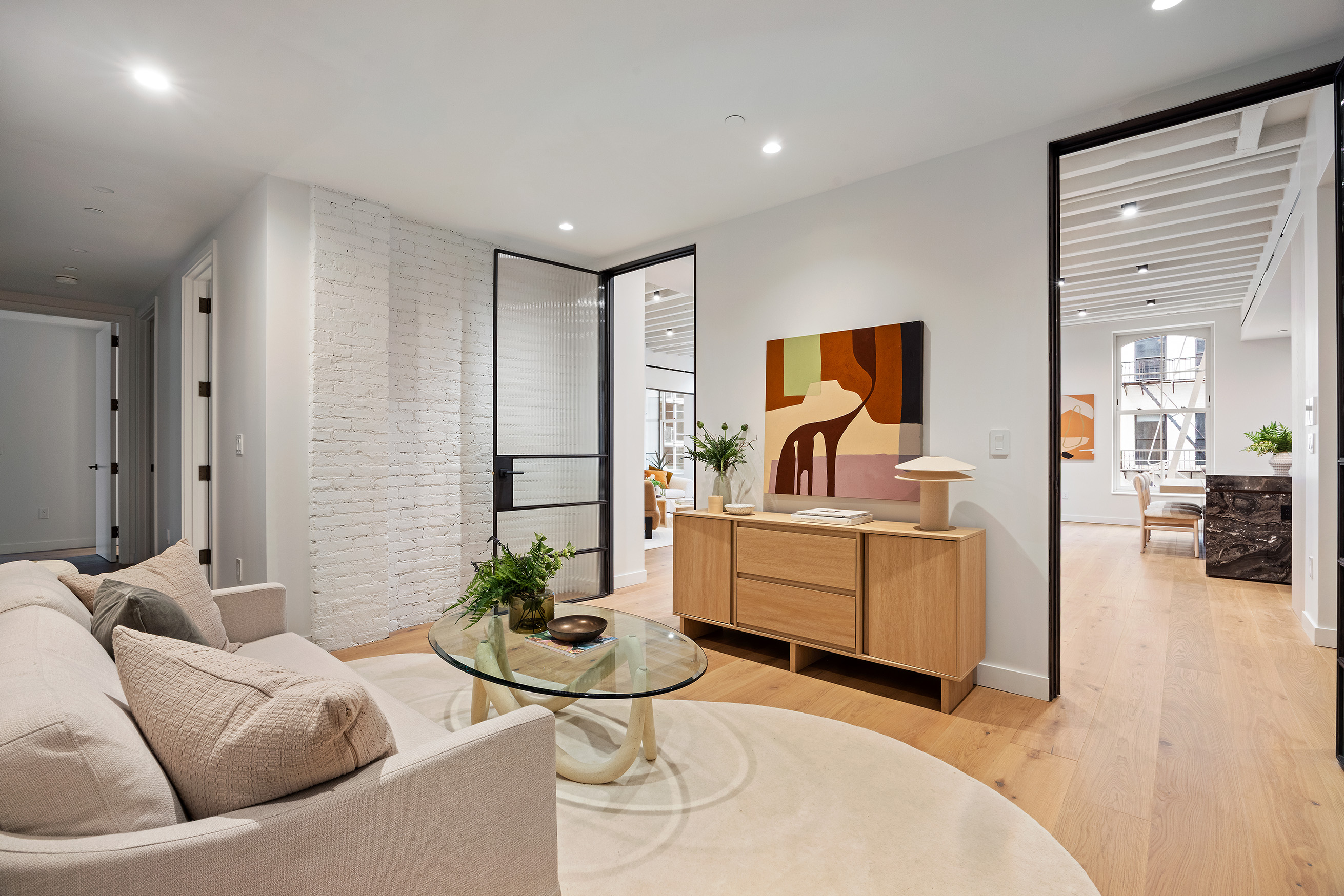 62 Reade Street, Unit 4 Manhattan, NY 10007 - Photo 8 of 20 a living room with furniture and wooden floor
