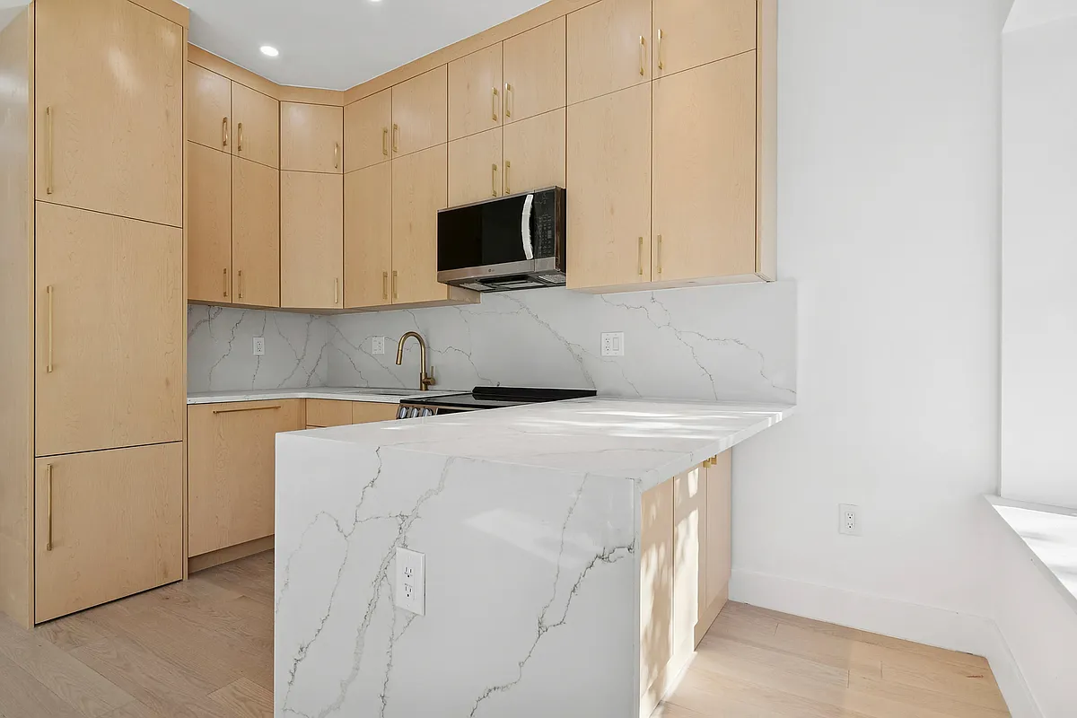 457 Bergen Street, Unit 2F Brooklyn, NY 11217 - Photo 6 of 12 a kitchen with a sink and a microwave