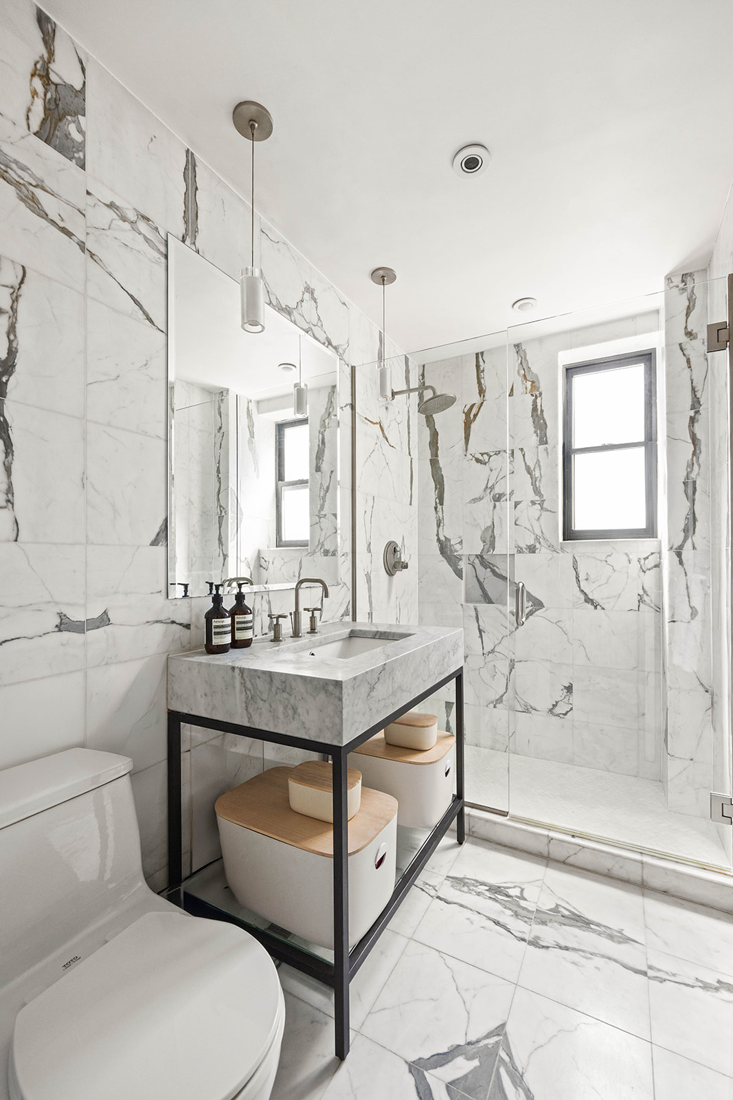 20 Clinton Street, Unit 4E Manhattan, NY 10002 - Photo 7 of 10 a bathroom with a granite countertop sink a toilet and shower