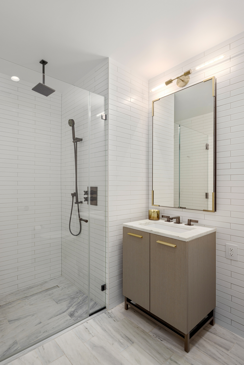 91 Leonard Street, Unit 4A Manhattan, NY 10013 - Photo 9 of 22 a bathroom with a double vanity sink mirror and shower