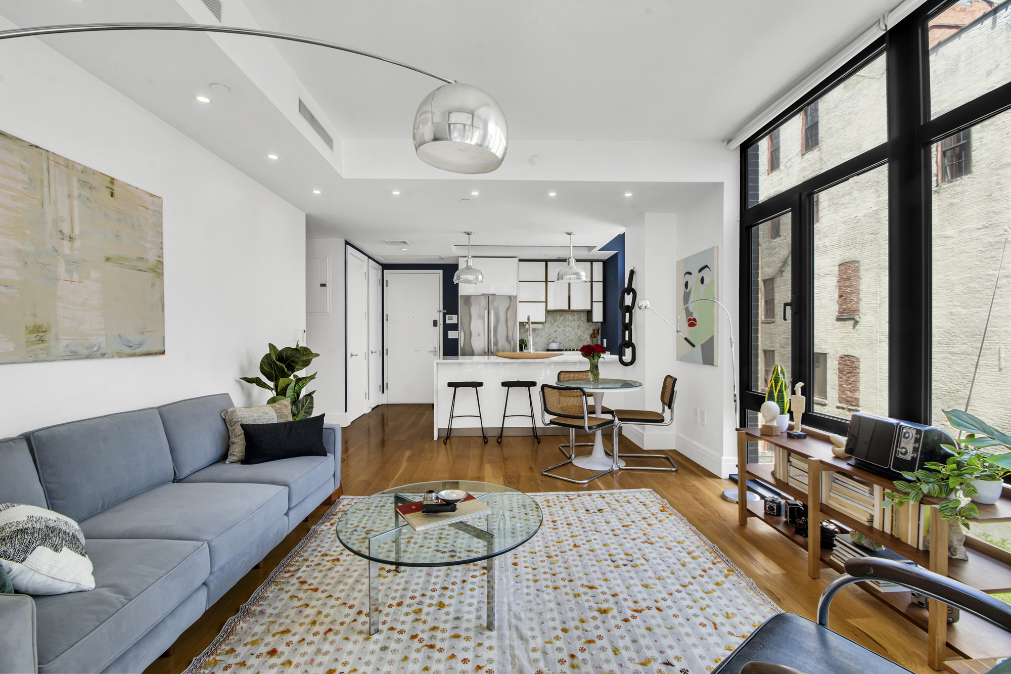 47 Bridge Street, Unit 3DD Brooklyn, NY 11201 - Photo 5 of 24 a living room with furniture and a large window