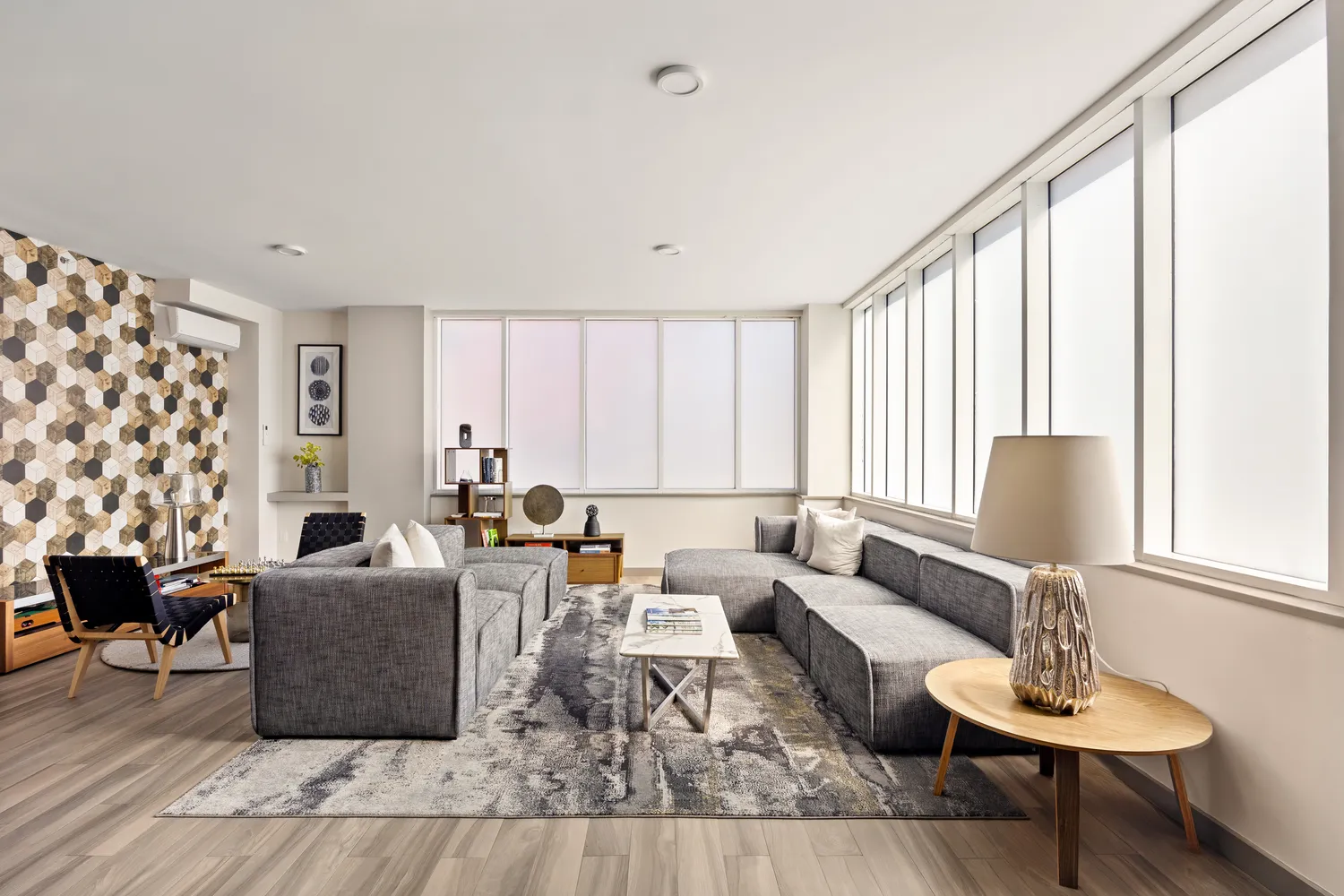 a living room with furniture and a large window