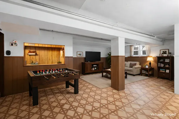 a living room with furniture window and a flat screen tv