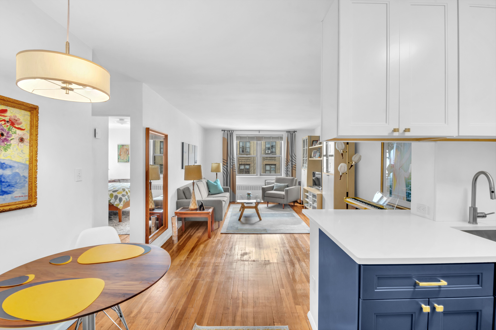 100 Overlook Terrace, Unit 85 Manhattan, NY 10040 - Photo 3 of 8 a living room with furniture a dining table and chairs