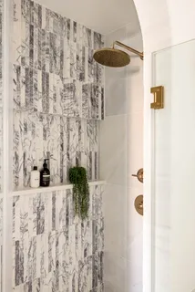 a bathroom with a shower curtain and a sink