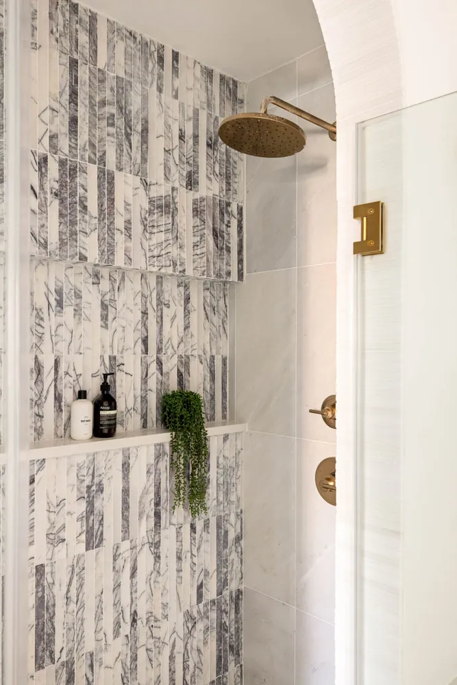 a bathroom with a shower curtain and a sink