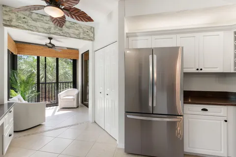 a kitchen with stainless steel appliances granite countertop a refrigerator and a stove