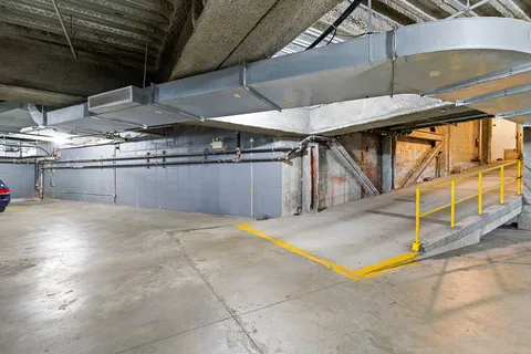 a view of an empty room with windows