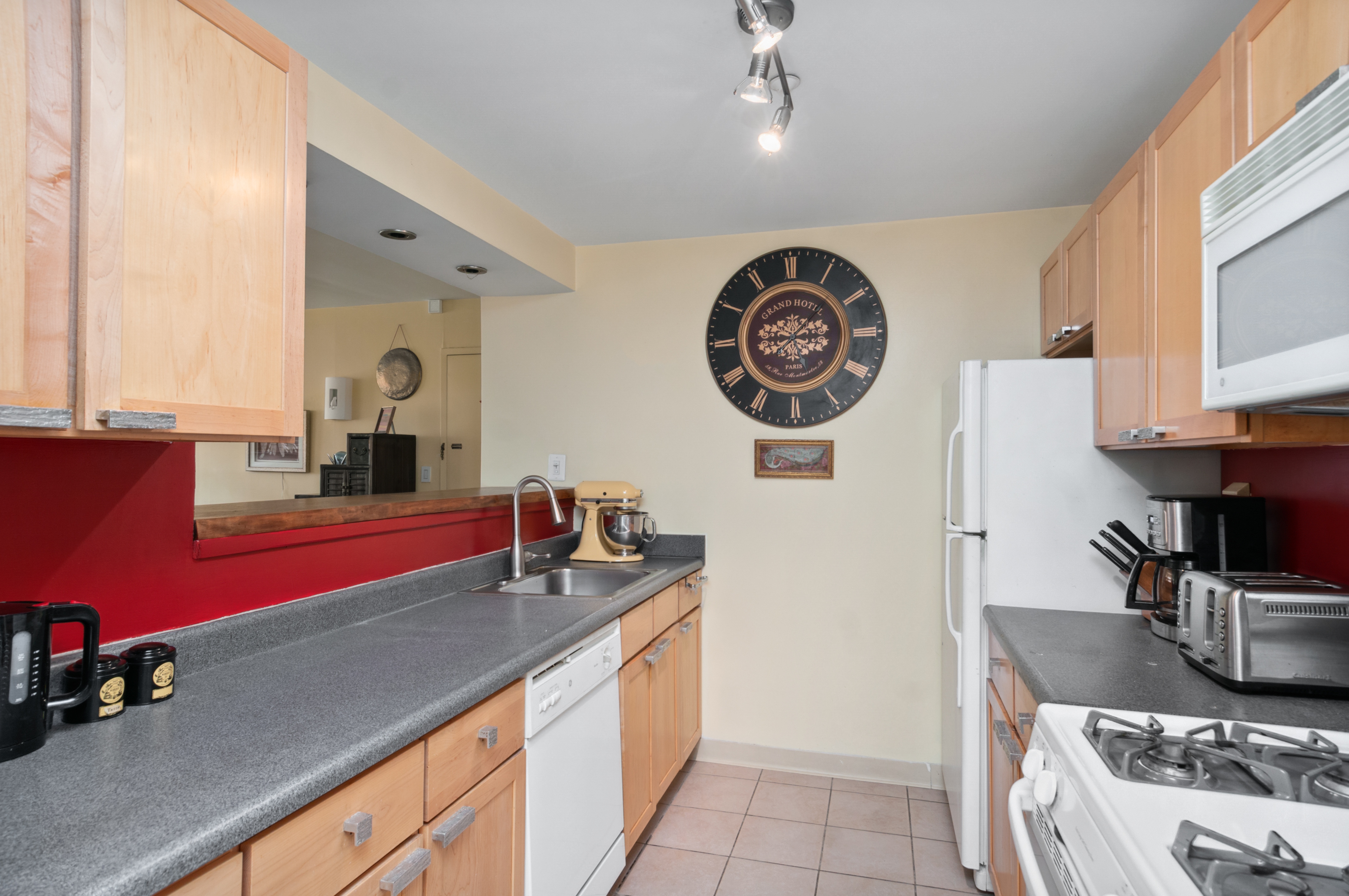 1787 Madison Avenue, Unit 505 Manhattan, NY 10035 - Photo 3 of 11 a kitchen with stainless steel appliances granite countertop a sink and a stove