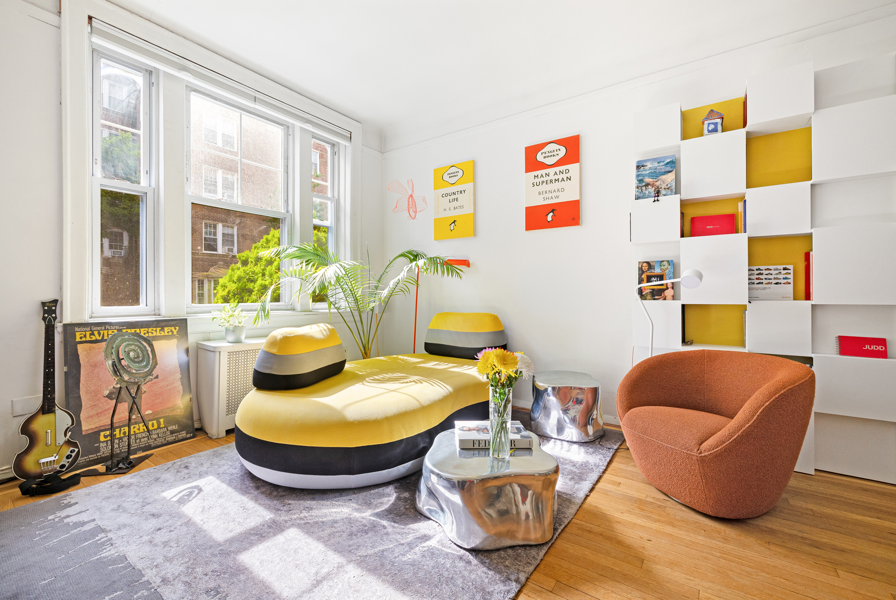 35-55 78th Street, Unit 1 Queens, NY 11372 - Photo 1 of 12 a living room with furniture and a floor to ceiling window