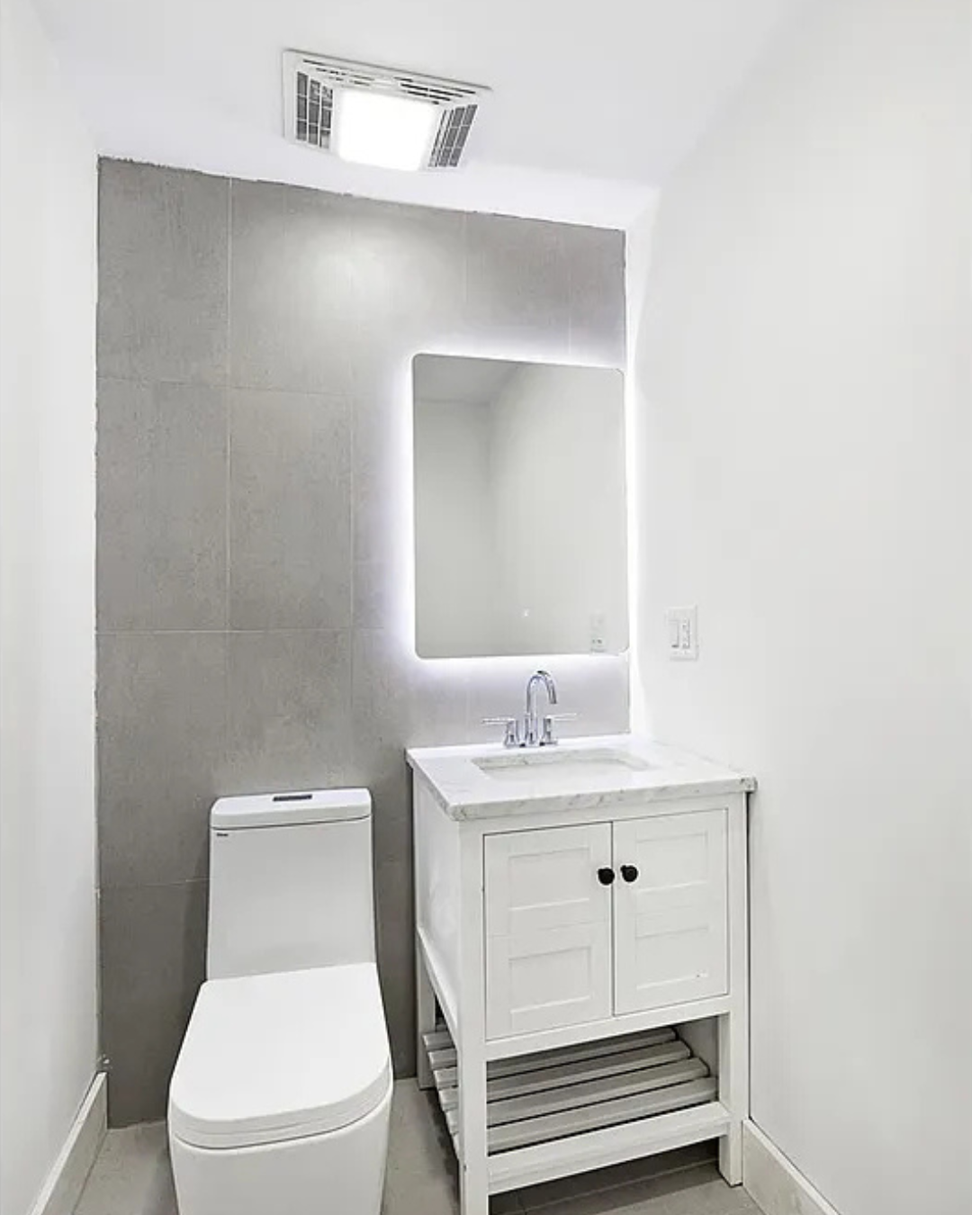 Saint Marks Avenue Brooklyn, NY 11213 - Photo 12 of 16 a bathroom with a toilet a sink and mirror