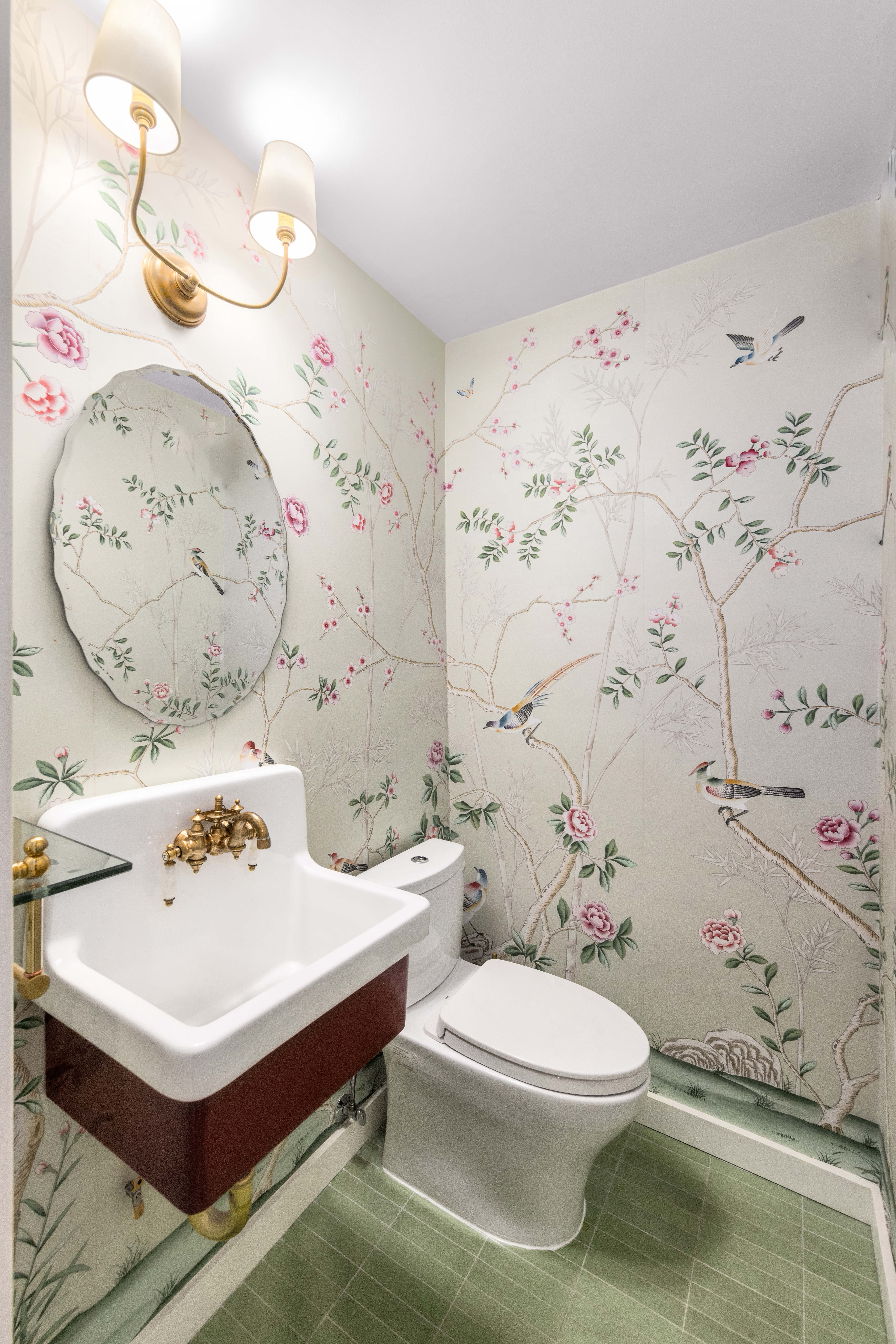 135 East 83rd Street, Unit 8/9C Manhattan, NY 10028 - Photo 7 of 15 a bathroom with a sink toilet and a mirror