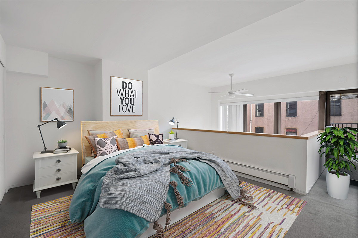 65 Cooper Square, Unit 3D Manhattan, NY 10003 - Photo 4 of 11 a bedroom with a large bed and a potted plant