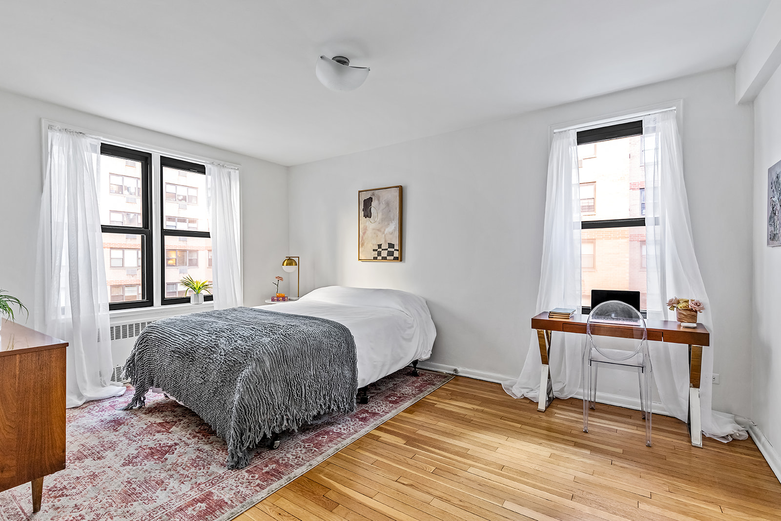 330 East 80th Street, Unit 5O Manhattan, NY 10075 - Photo 5 of 7 a spacious bedroom with a bed and a window