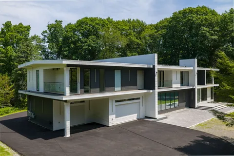 a view of house with a swimming pool
