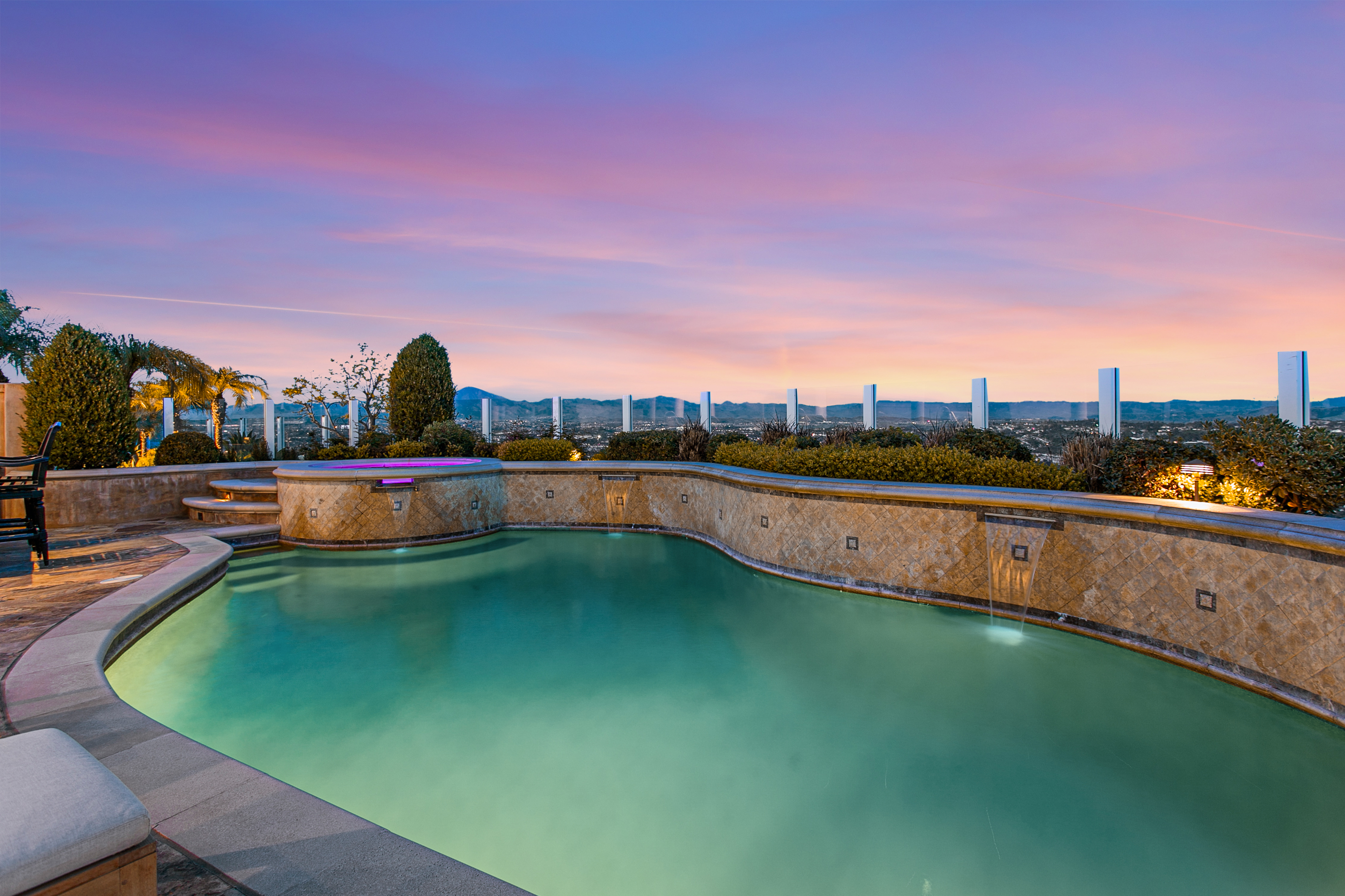 10 Vista Montemar Laguna Niguel, CA 92677 - Photo 25 of 67 a view of a swimming pool with an outdoor seating and a garden