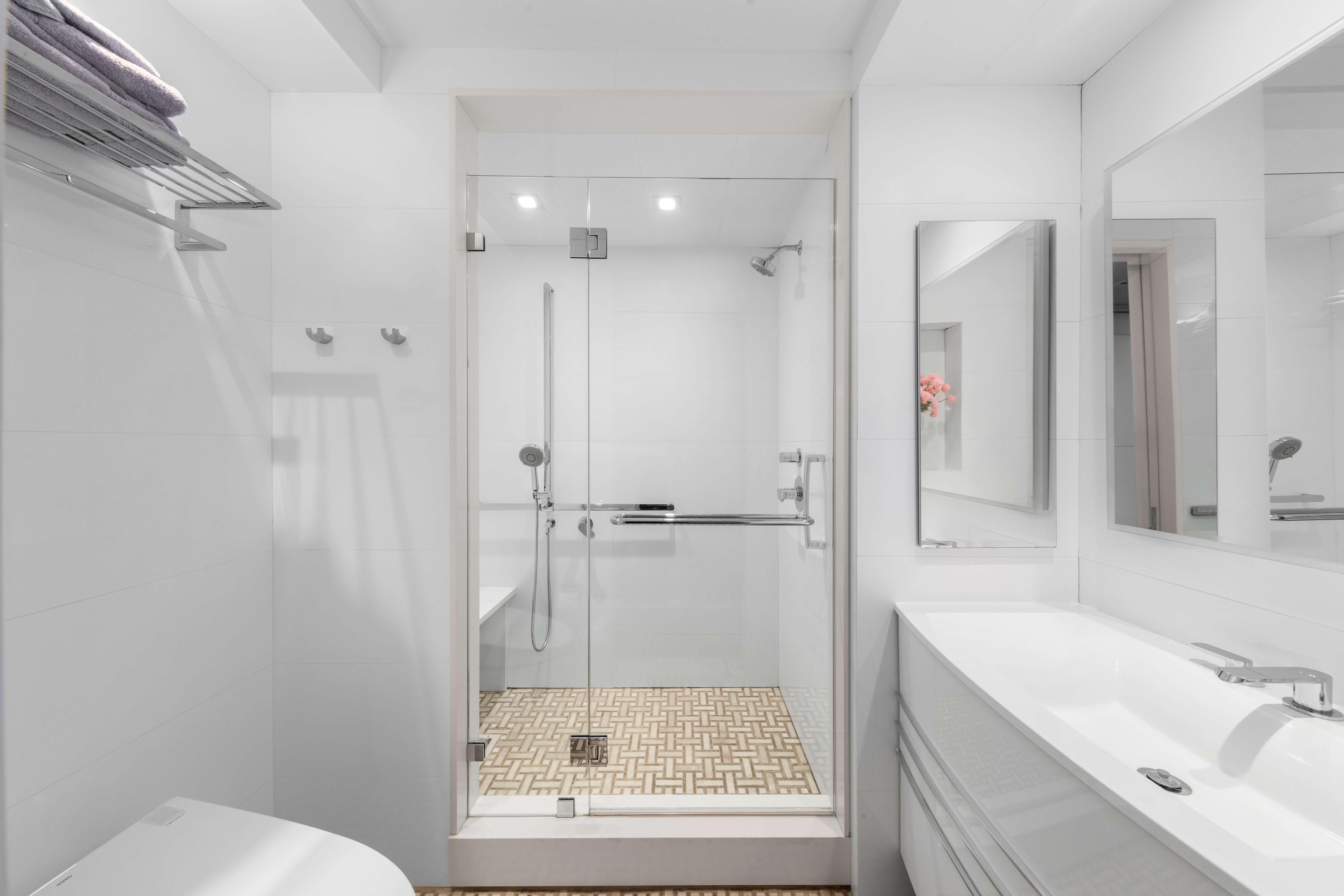 207 East 74th Street, Unit 1J Manhattan, NY 10021 - Photo 8 of 9 a bathroom with a sink a toilet and shower