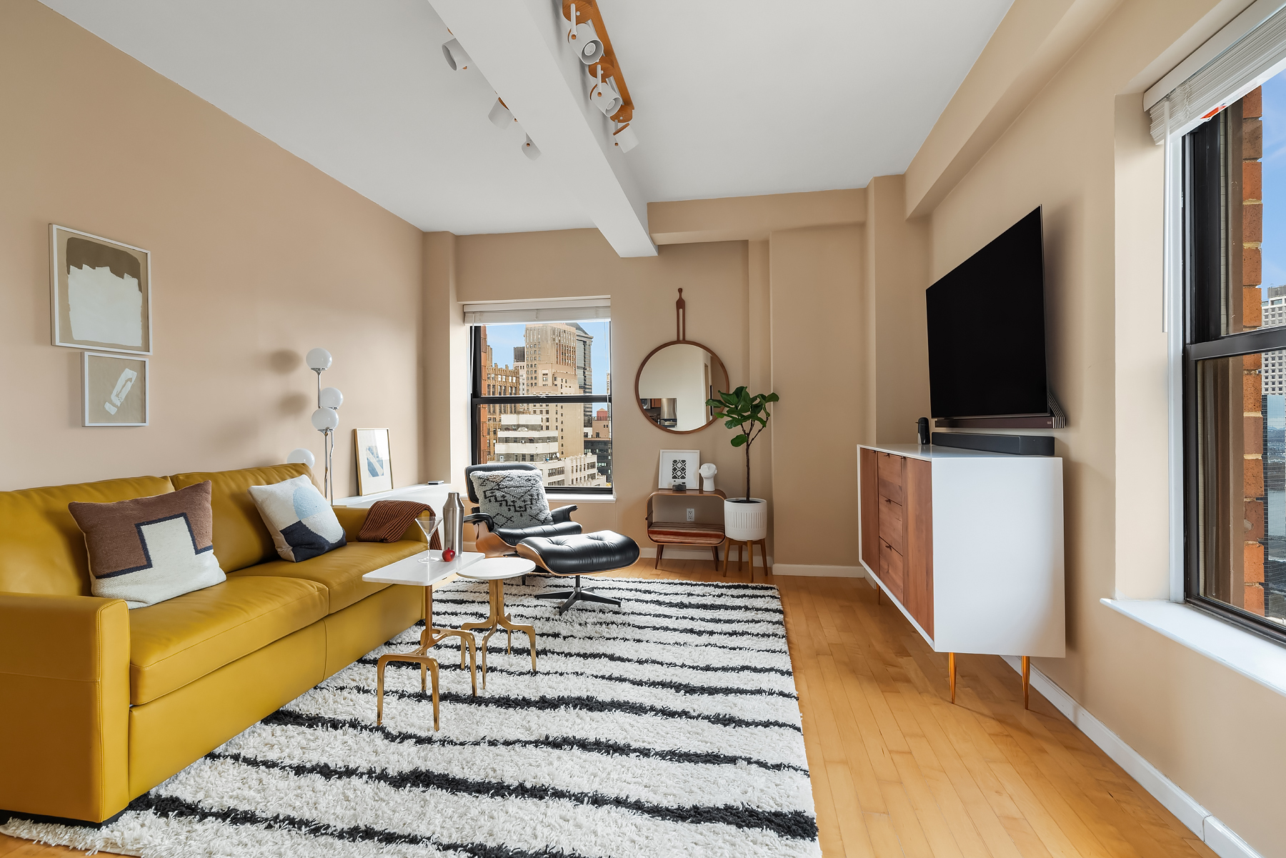 a living room with furniture and a flat screen tv