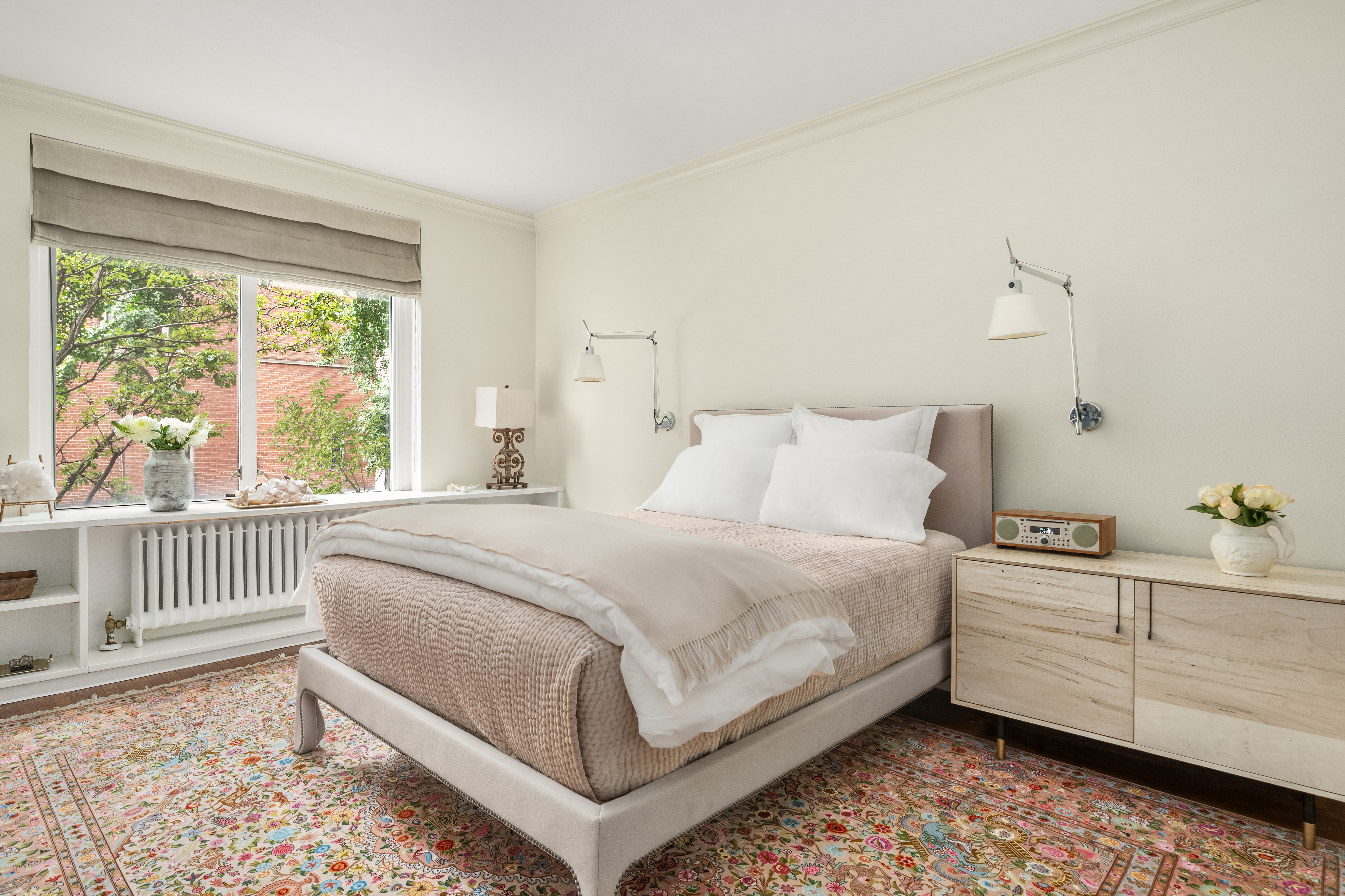 455 East 51st Street, Unit 2F Manhattan, NY 10022 - Photo 7 of 17 a bedroom with a bed and a window