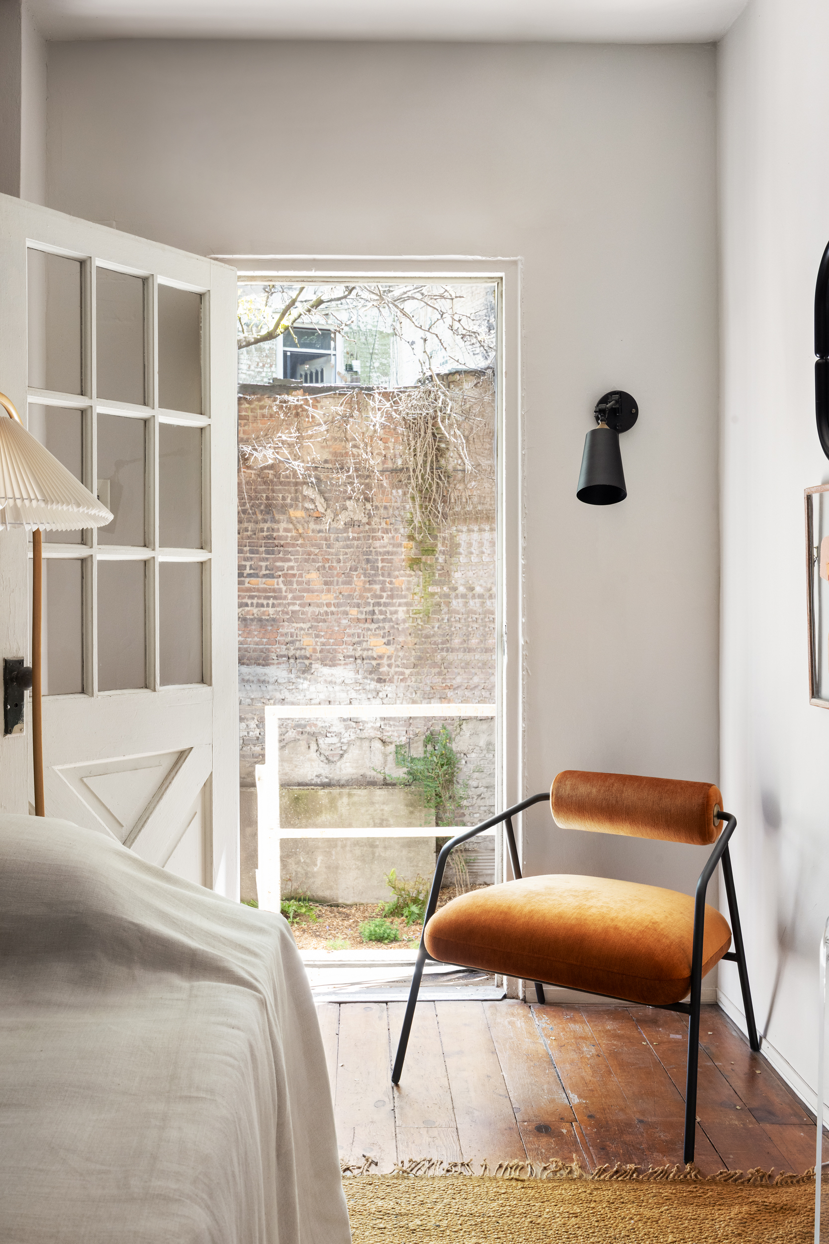 765 Greenwich Street, Unit 1 Manhattan, NY 10014 - Photo 12 of 18 a bedroom with a bed and wooden floor