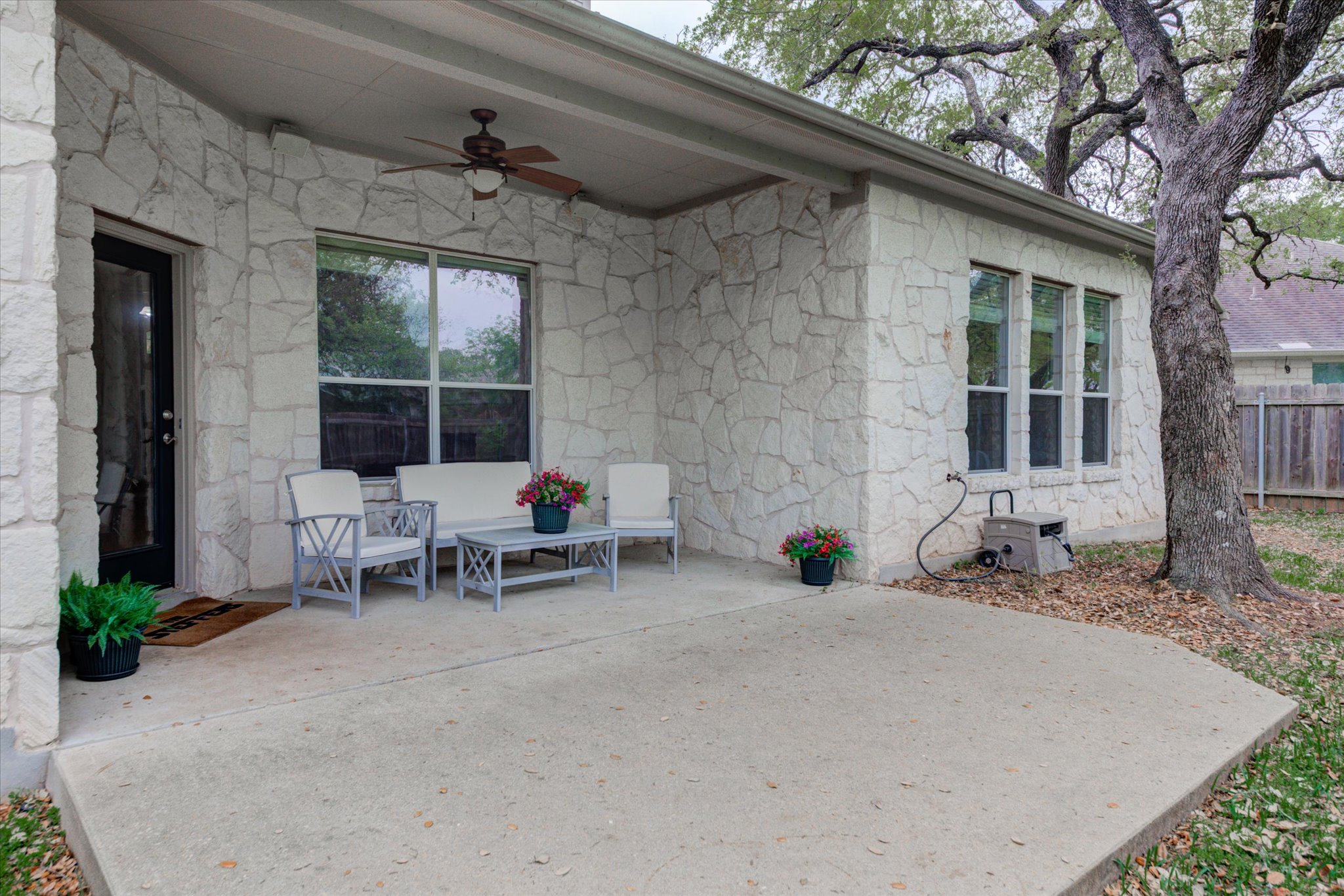 5412 Batak Lane Austin, TX 78749 - Photo 38 of 40 a view of a patio with table and chairs and potted plants