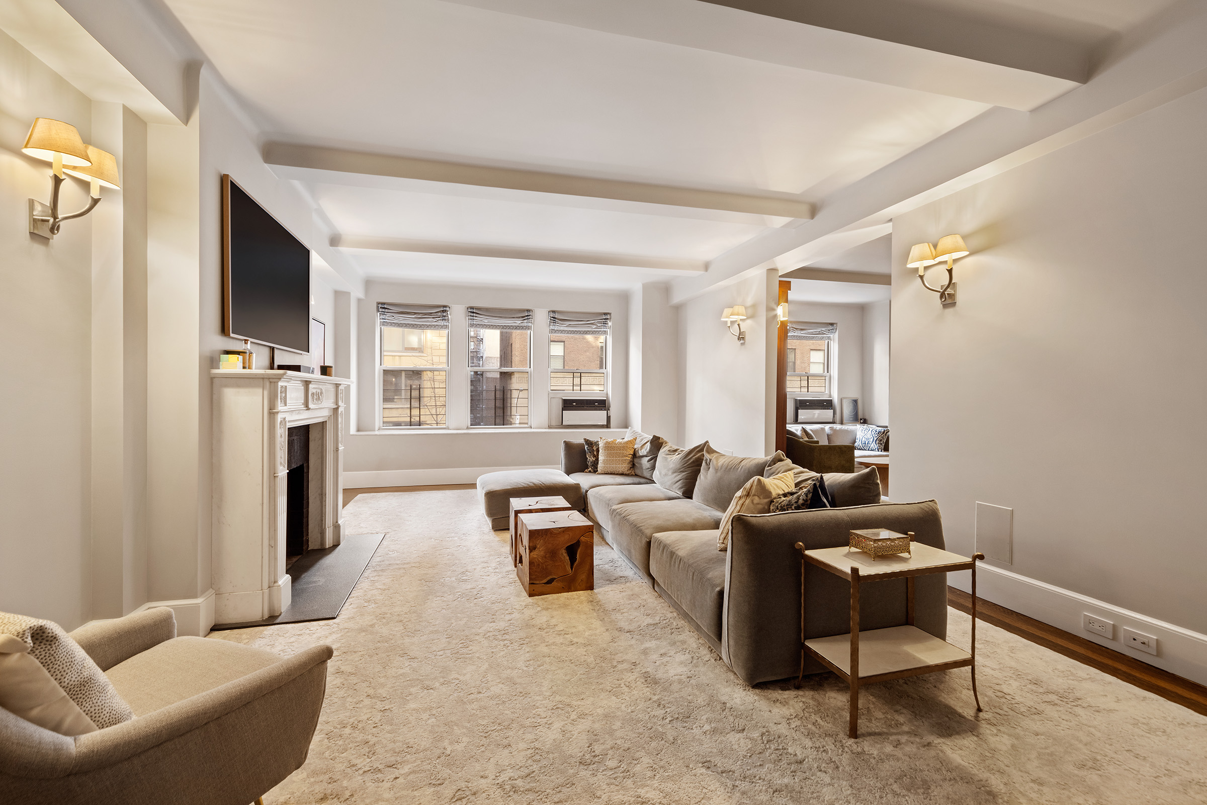 25 East 86th Street, Unit 3C Manhattan, NY 10028 - Photo 2 of 15 a living room with furniture and a window