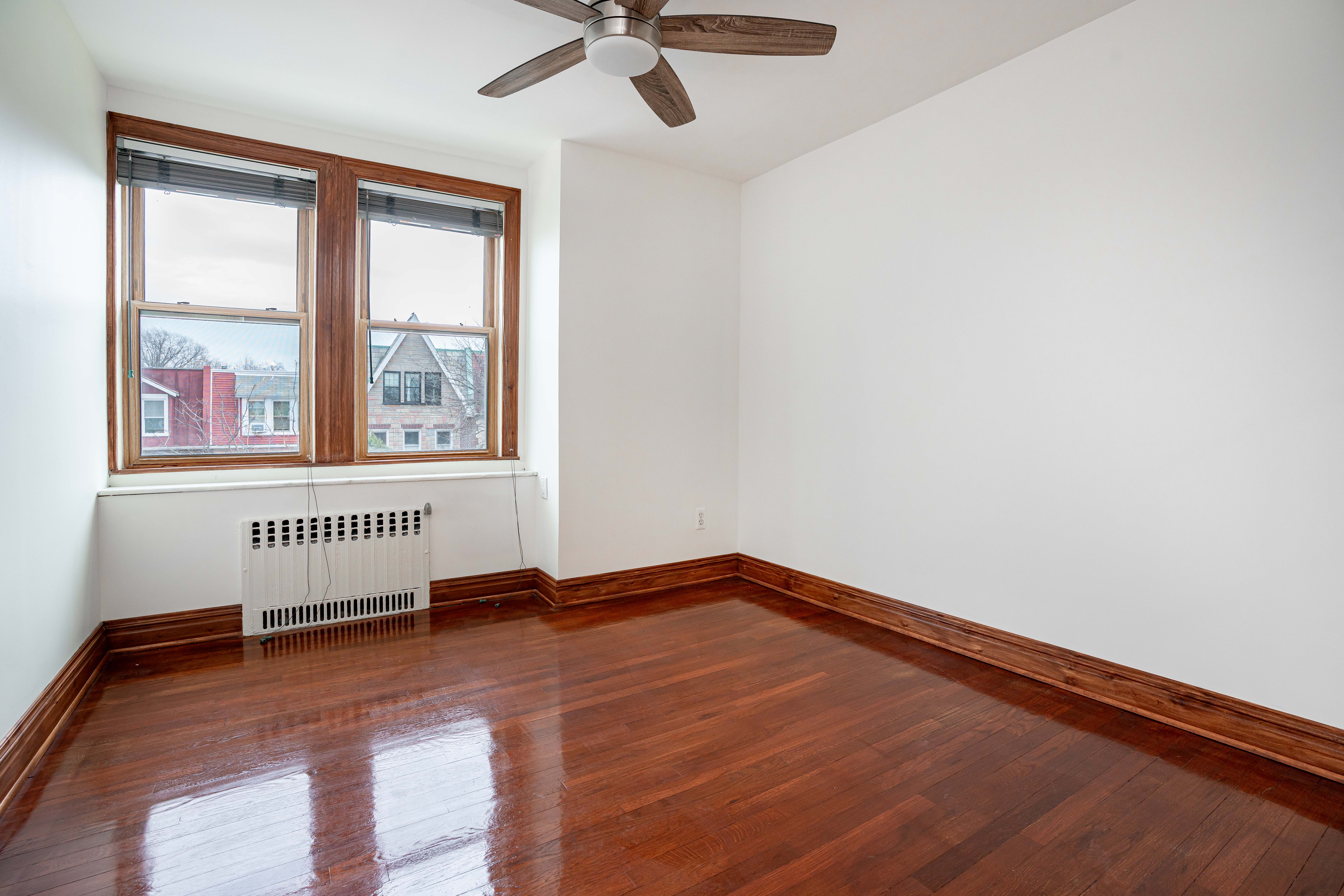 20-60 33rd Street, Unit 2 Queens, NY 11105 - Photo 7 of 10 a view of an empty room with a window