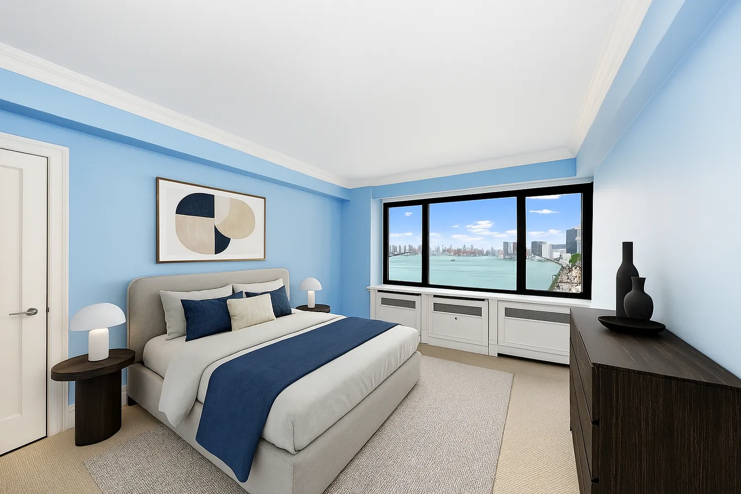 a bedroom with a large bed and a large window