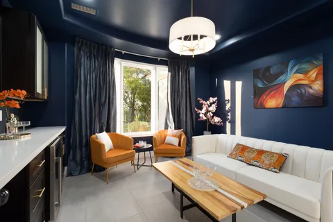 a bathroom with a tub sink and window