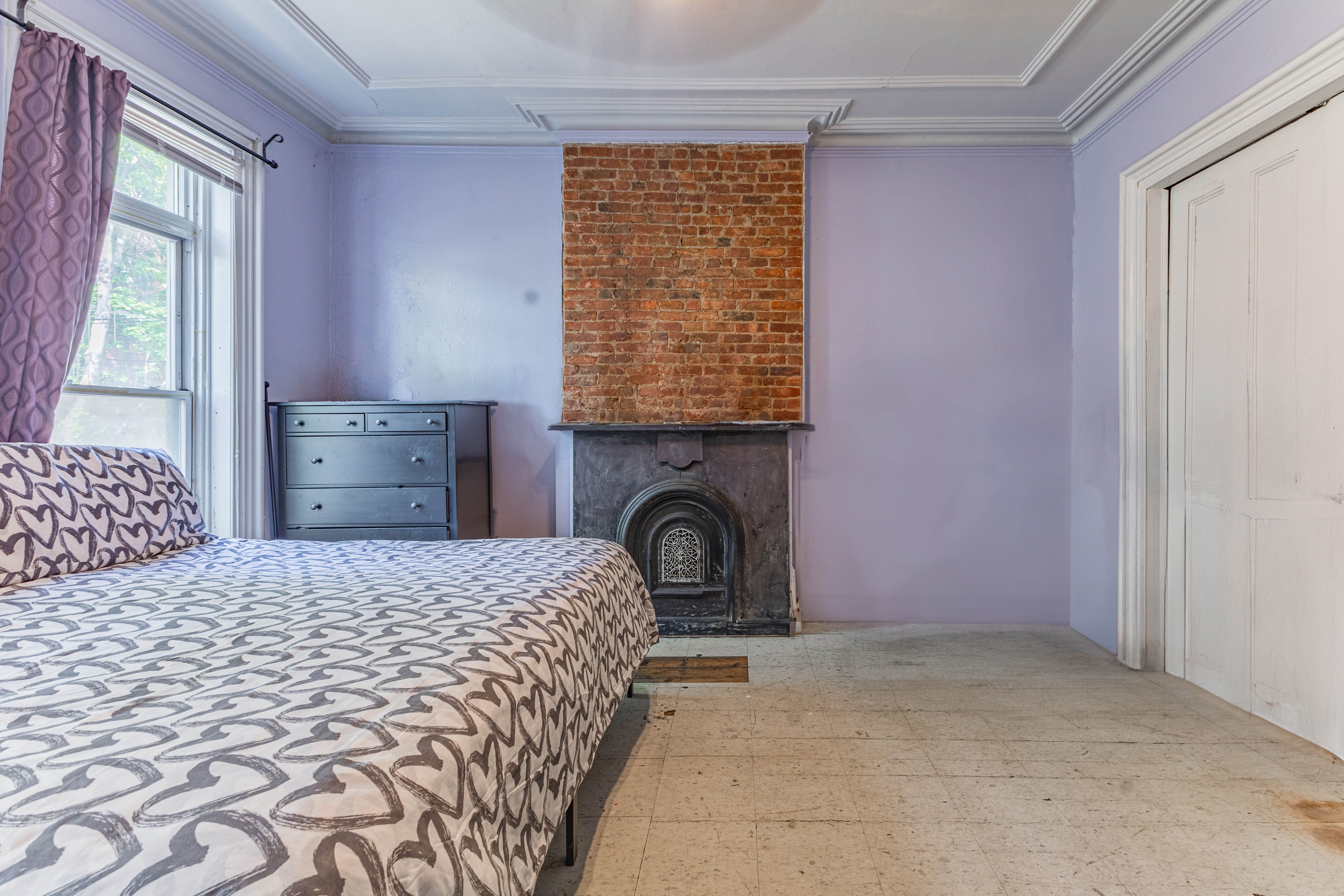 799 Willoughby Avenue Brooklyn, NY 11206 - Photo 5 of 12 a bedroom with a bed and a window
