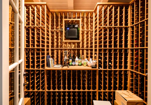 a living room with furniture and a book shelf