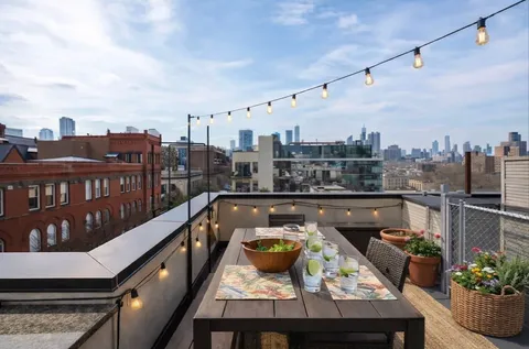 a view of a balcony with furniture