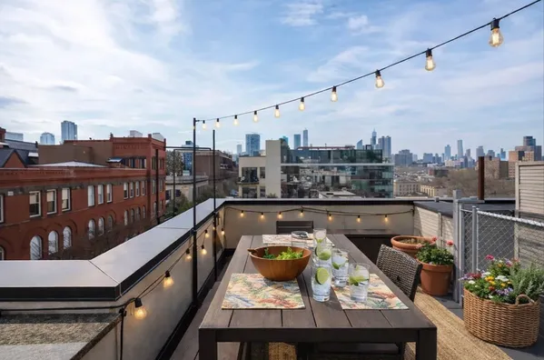 a view of a balcony with furniture