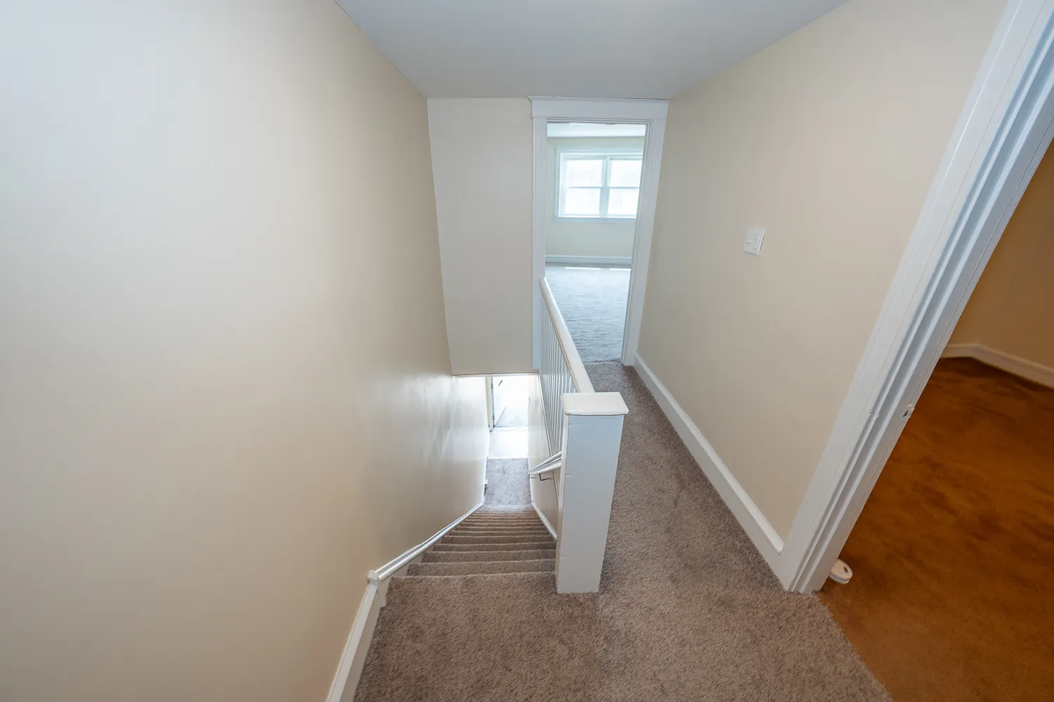 a view of a hallway with staircase