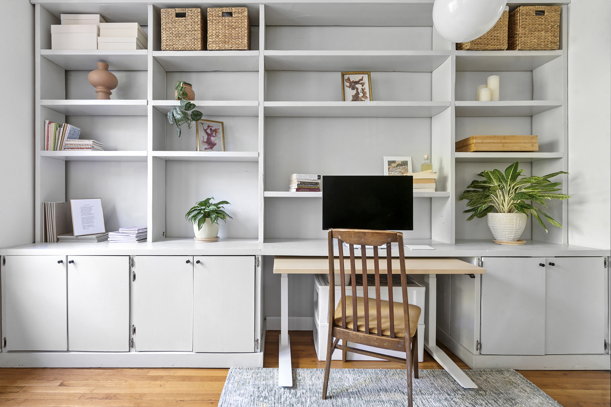 338 Prospect Place, Unit 2B Brooklyn, NY 11238 - Photo 2 of 7 a living room with a potted plant on a stool and a potted plant
