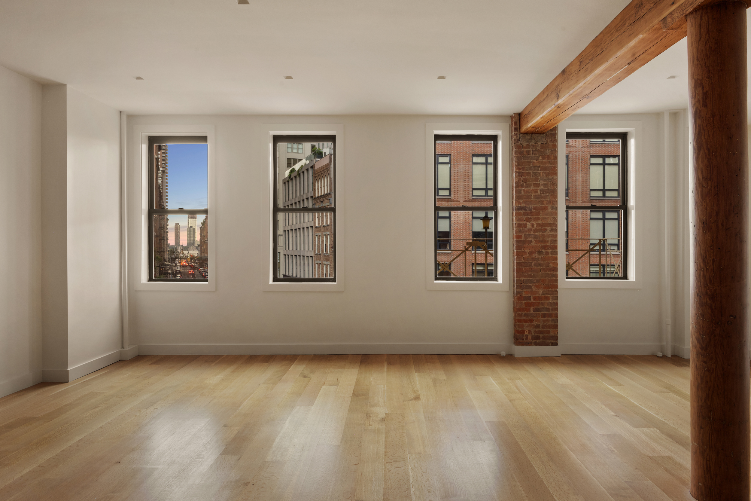 243 West Broadway, Unit 4 Manhattan, NY 10013 - Photo 5 of 14 an empty room with windows