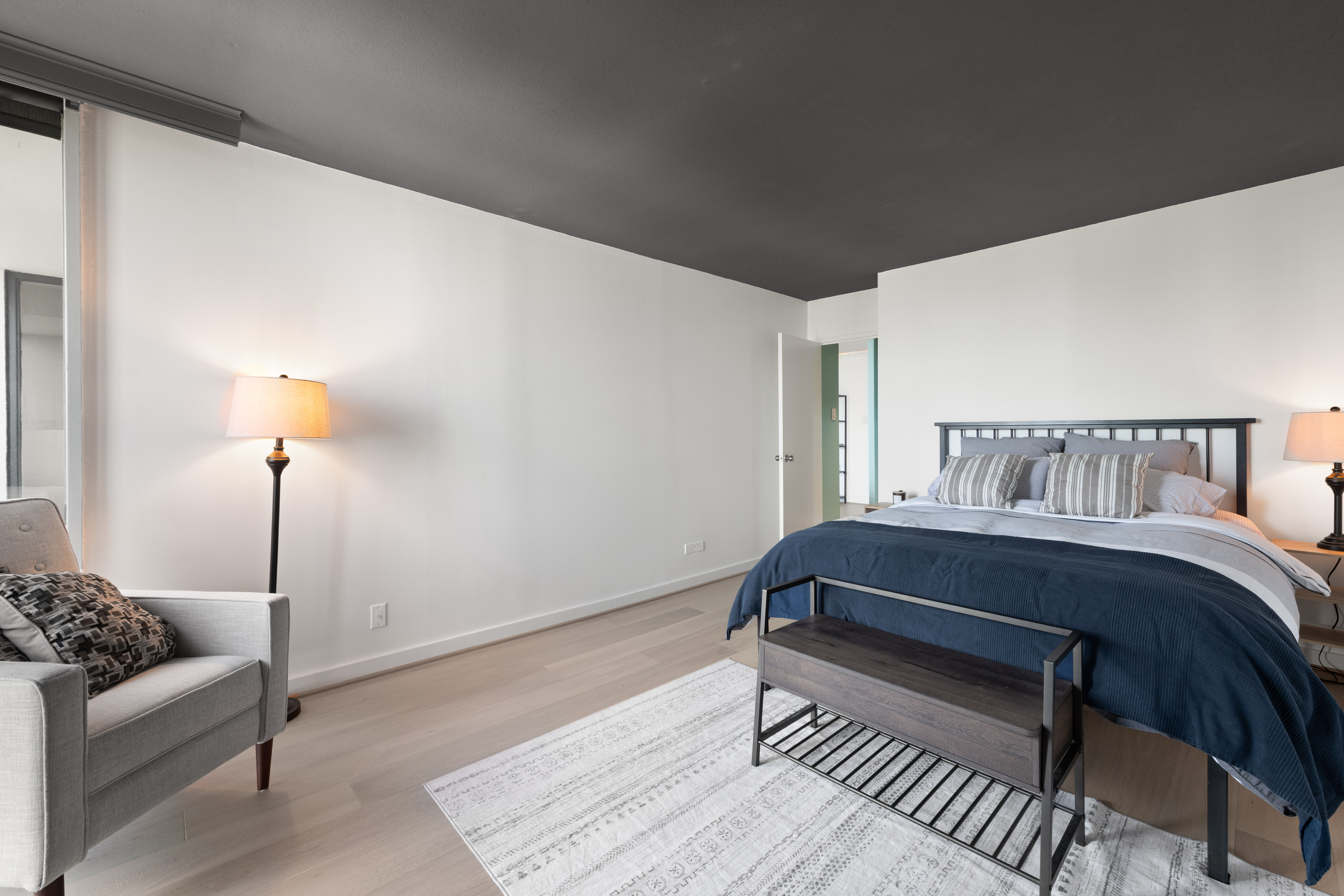 490 M Street Southwest, Unit W802 Washington, DC 20024 - Photo 10 of 24 a bedroom with furniture and a wooden floor