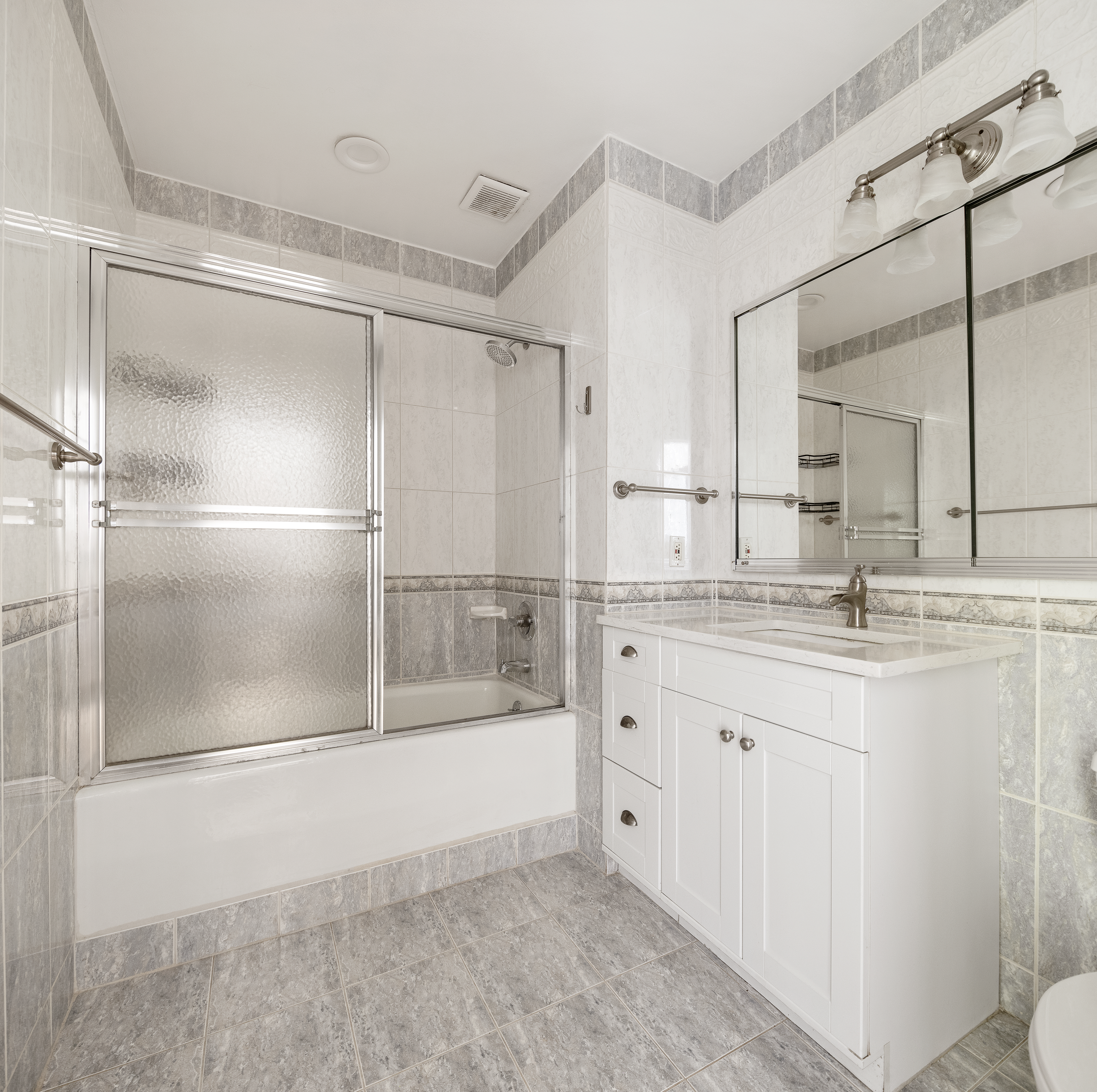 51 South Portland Avenue Brooklyn, NY 11217 - Photo 7 of 18 a bathroom with a granite countertop shower sink and mirror