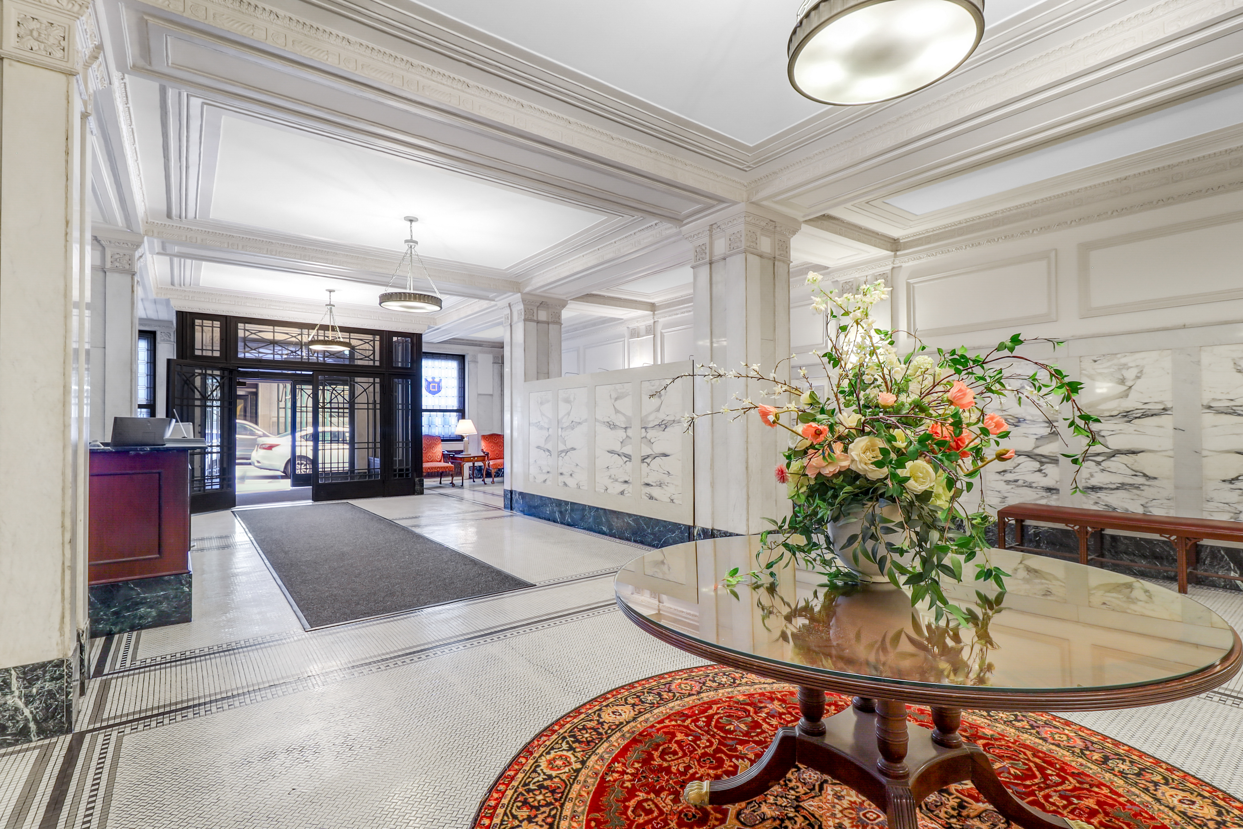 215 West 91st Street, Unit 77 Manhattan, NY 10024 - Photo 14 of 17 a living room with furniture and flowers