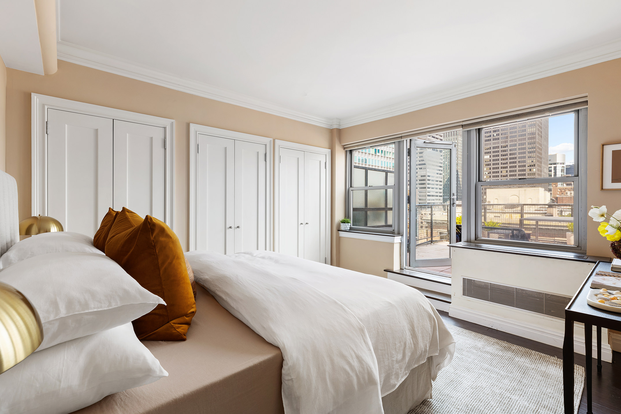 80 Park Avenue, Unit 19N Manhattan, NY 10016 - Photo 16 of 20 a bedroom with a bed and a large window