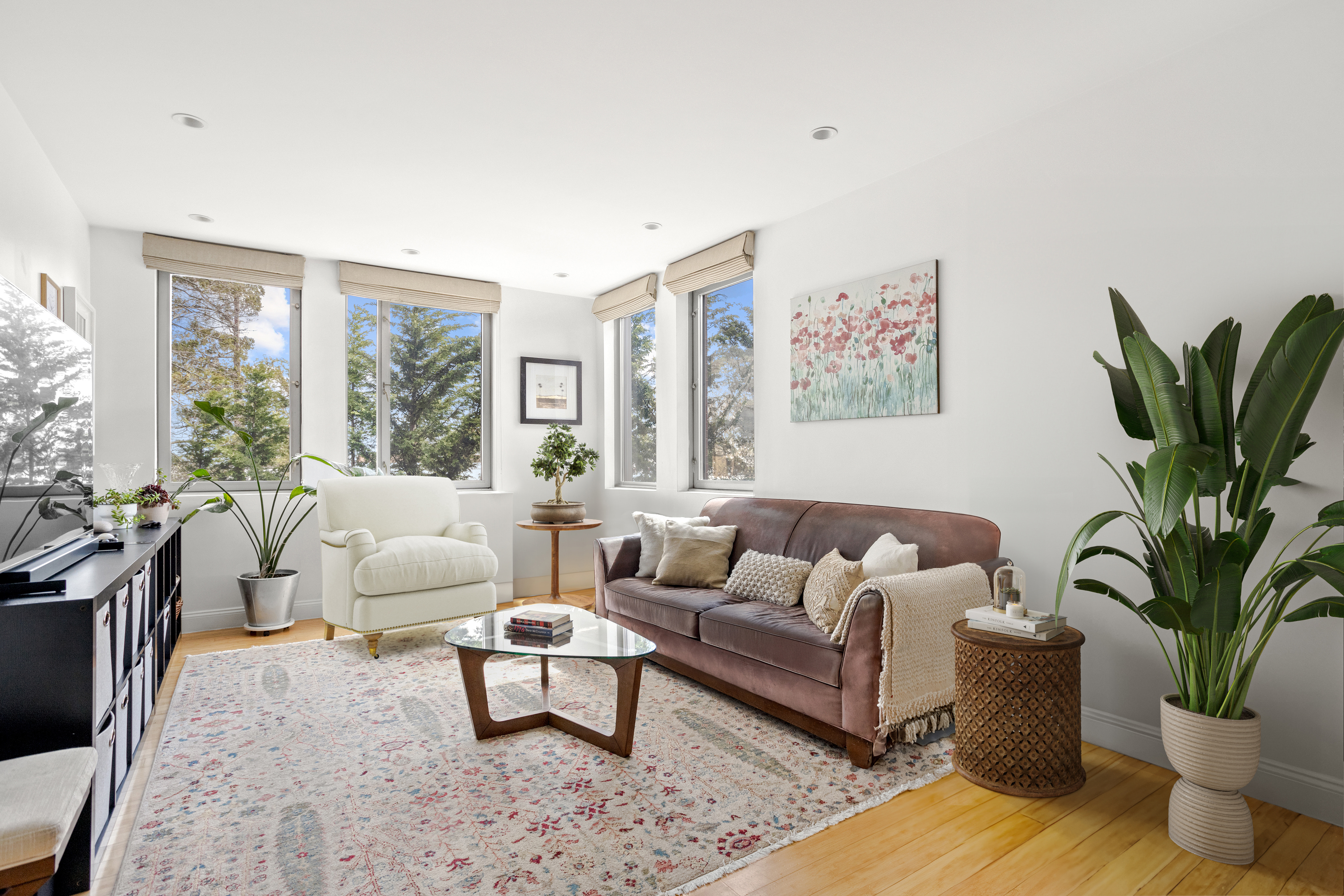 35 McDonald Avenue, Unit 2B Brooklyn, NY 11218 - Photo 2 of 10 a living room with furniture potted plant and a large window
