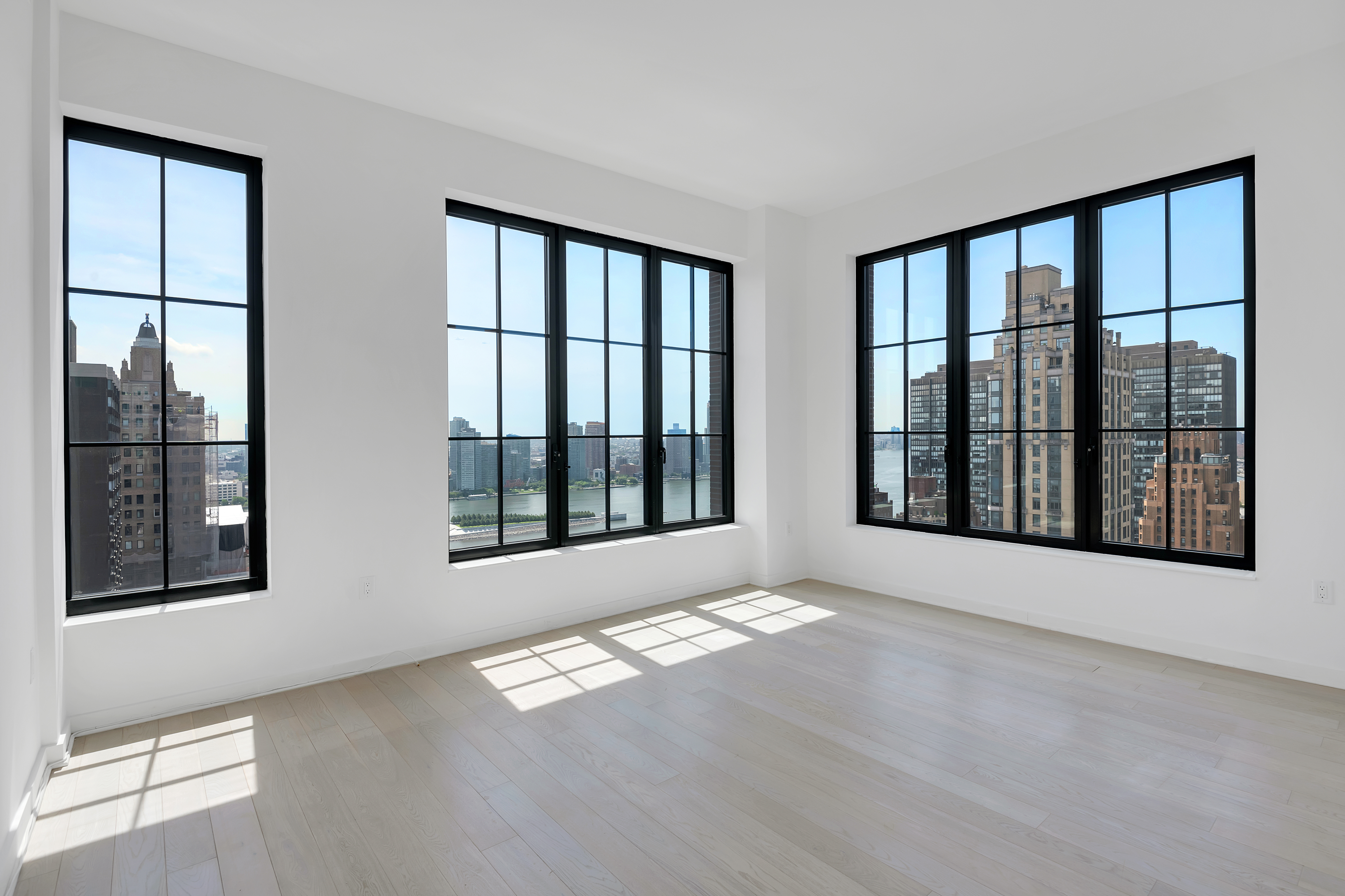 959 1st Avenue, Unit 25H Manhattan, NY 10022 - Photo 7 of 18 a view of an empty room with a window