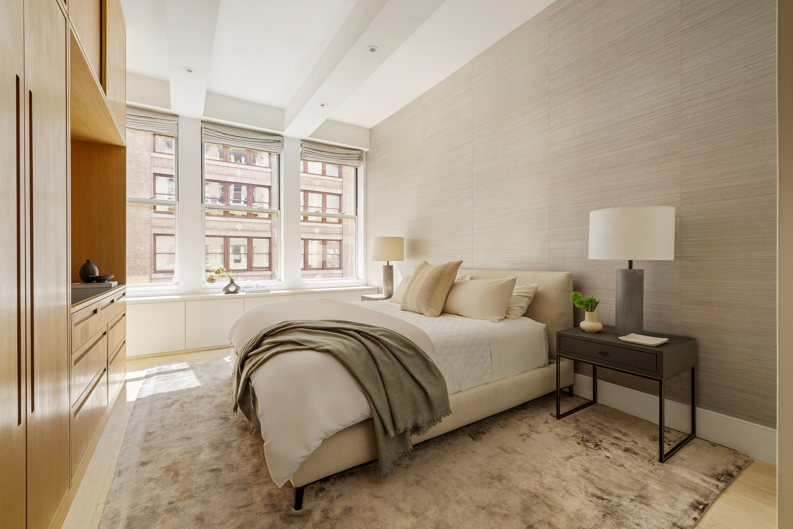 49 East 21st Street, Unit 9A Manhattan, NY 10010 - Photo 10 of 18 a spacious bedroom with a bed a mirror and a window