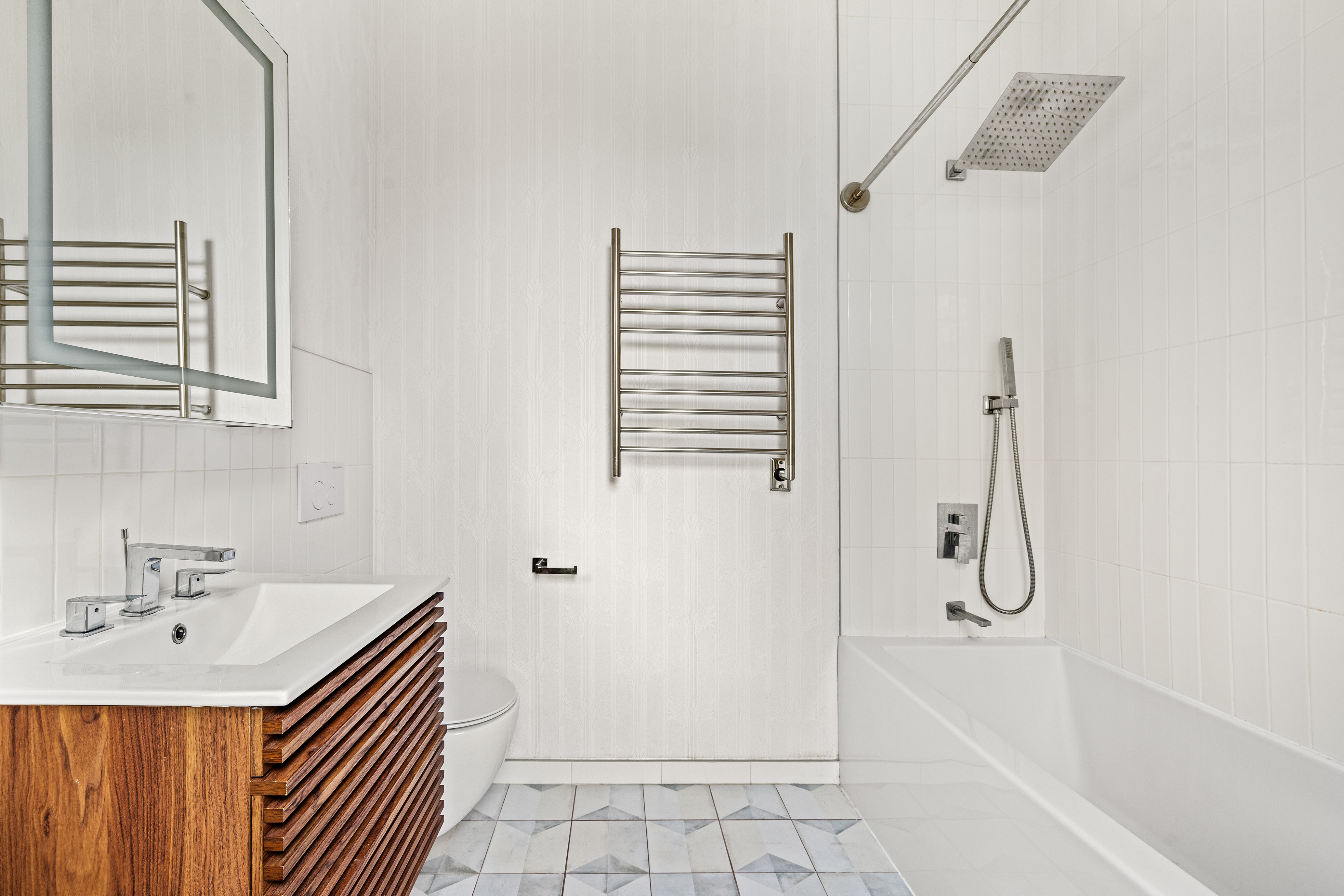 285 Weirfield Street Brooklyn, NY 11221 - Photo 8 of 16 a bathroom with a granite countertop sink a mirror and shower