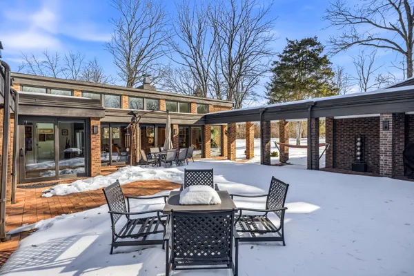 a outdoor space with patio furniture and wooden floor